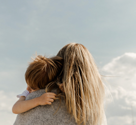 woman nursing a young child