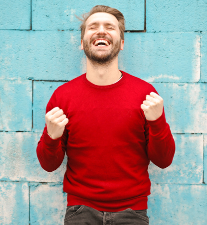 FIAP man in red sweater smiling