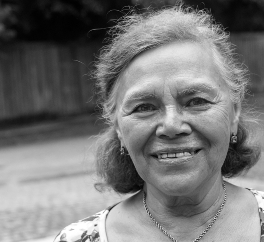 older woman with short hair smiling